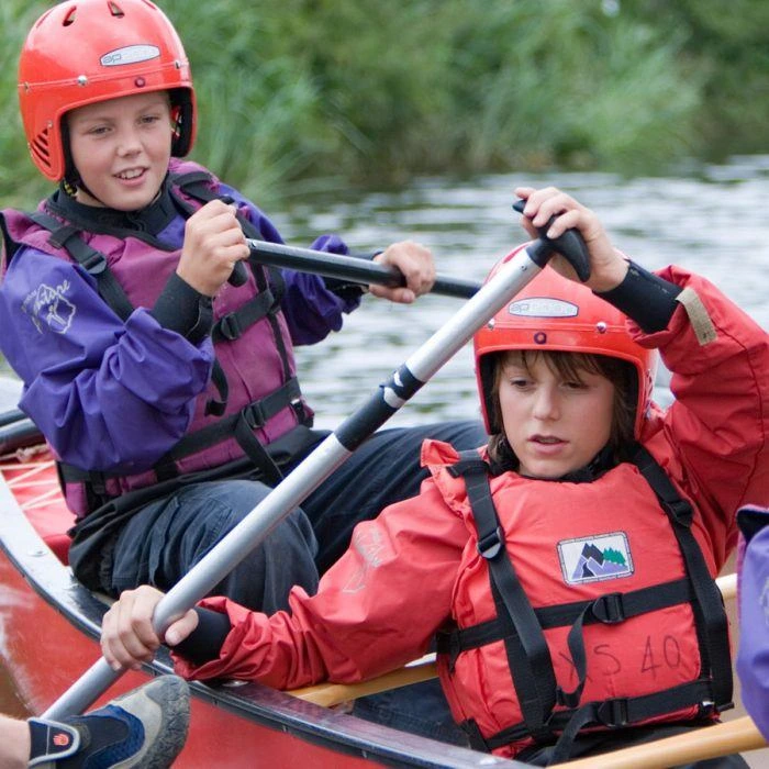 Seconday school children doing the watersports activity open canoeing at CORNWALL COUNTY PLAYING FIELDS ASSOCIATION Adventure Centres